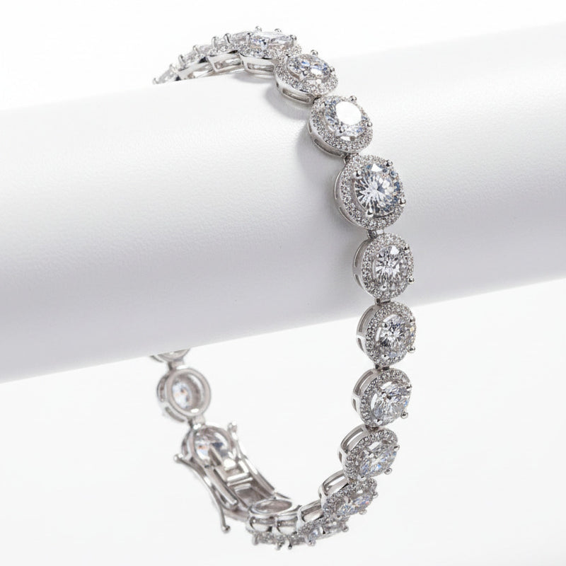 Sterling silver moissanite bracelet with round bezel-set stones and hinged clasp