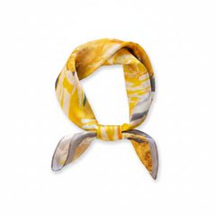 Silk square scarf, yellow and white print with gray accents, folded into knot
