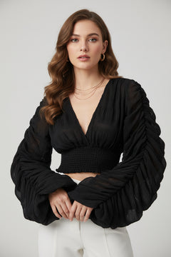 Black long-sleeve blouse with V-neck and smocked ruched waist, gathered puff sleeves