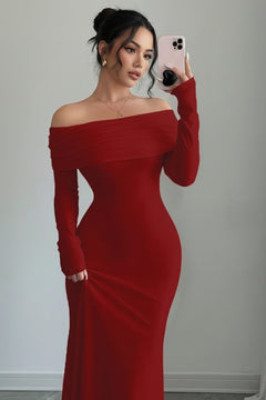 Red off-shoulder long sleeve maxi dress with fitted bodice and off-shoulder neckline.