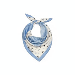 Light blue printed silk square scarf with crescent moon pattern and tied bow