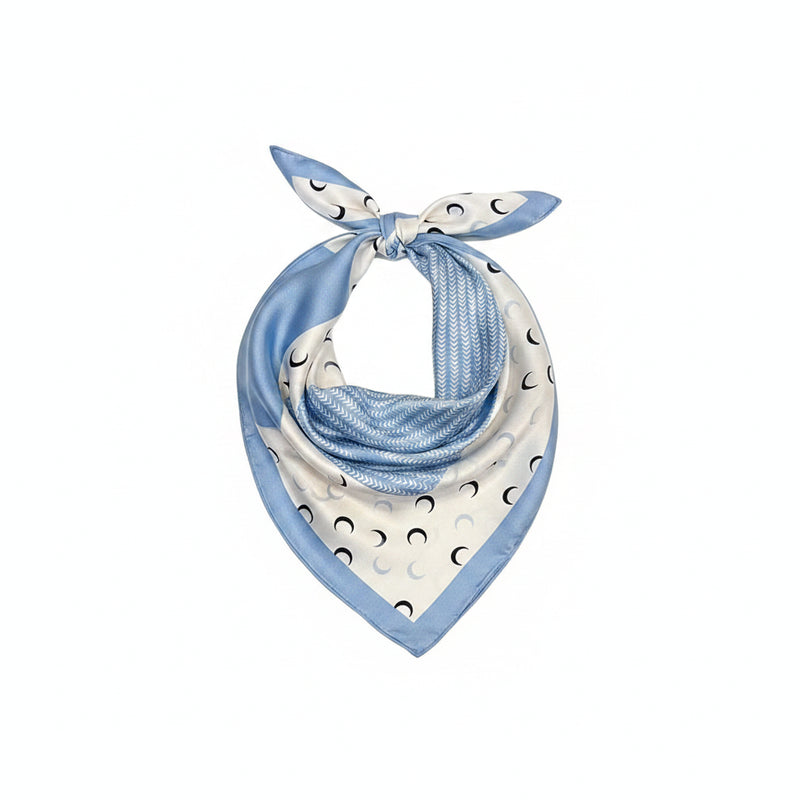 Light blue printed silk square scarf with crescent moon pattern and tied bow