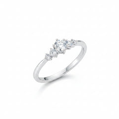Sterling silver moissanite three-stone ring, round center stone and two side stones in prongs