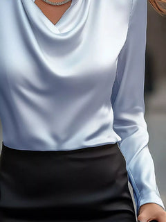 Sky blue satin cowl neck long-sleeve blouse with draped neckline and smooth fabric