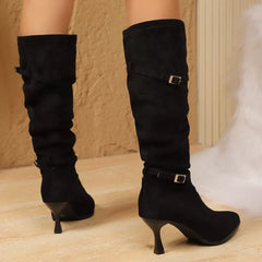 Black point-toe kitten heel boots with stacked buckles at mid-calf