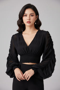 Black long-sleeve blouse with V-neck and smocked ruched waist, voluminous sleeves