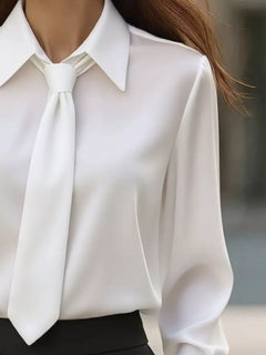 White long-sleeve blouse with pointed collar and neck tie