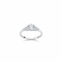 Sterling silver moissanite three-stone ring front angle, round center stone with side stones