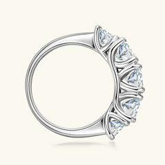 925 sterling silver moissanite ring with side prong-set round clear stones, angled view