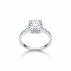 Sterling silver ring featuring round moissanite with four-prong head