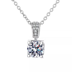 Sterling silver necklace pendant with prong-set cushion-cut moissanite and pavé frame