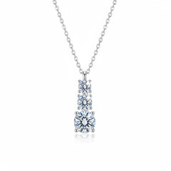 Sterling silver pendant necklace with three round moissanite stones, close view