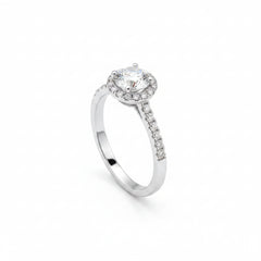 Side view of sterling silver halo moissanite solitaire ring with pavé detail