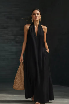 Black halter neck sleeveless maxi dress with deep V-neck and wide skirt