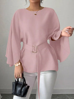 Blush pink batwing-sleeve belted blouse with flared sleeves and square buckle