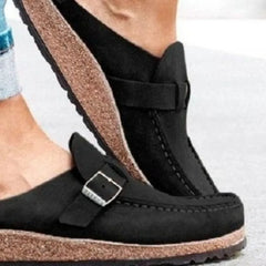 Black round-toe low-heel loafer with front buckle strap and stitched side panel