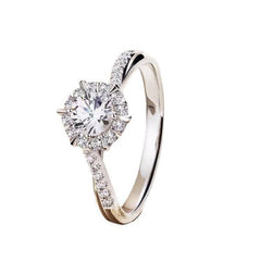 Sterling silver ring with round moissanite center and pavé split shoulders