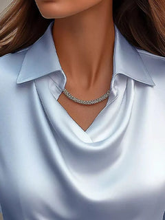 Sky blue satin cowl neck blouse with draped V neckline and pointed collar