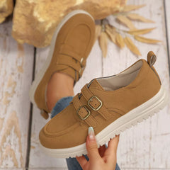 Tan suede buckle-accent casual loafer with double buckle strap detail and white sole