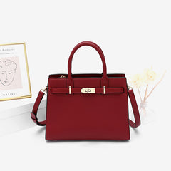 Burgundy leather handbag with top handles and detachable shoulder strap