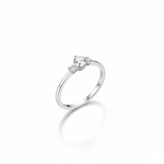 Sterling silver solitaire ring with round moissanite center and small pavé accents