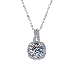 Cushion-cut moissanite pendant with halo accents and pavé band on silver chain