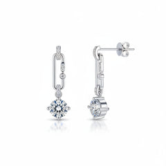 Silver moissanite drop earrings shown from the side with round dangling stone