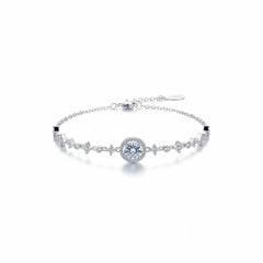 Silver moissanite bracelet featuring a round center stone and starry pavé details