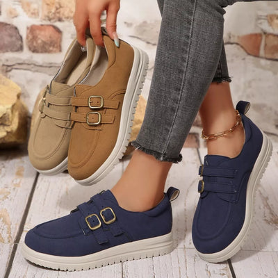 Brown and navy buckle-accent casual loafers with double buckle straps and white soles