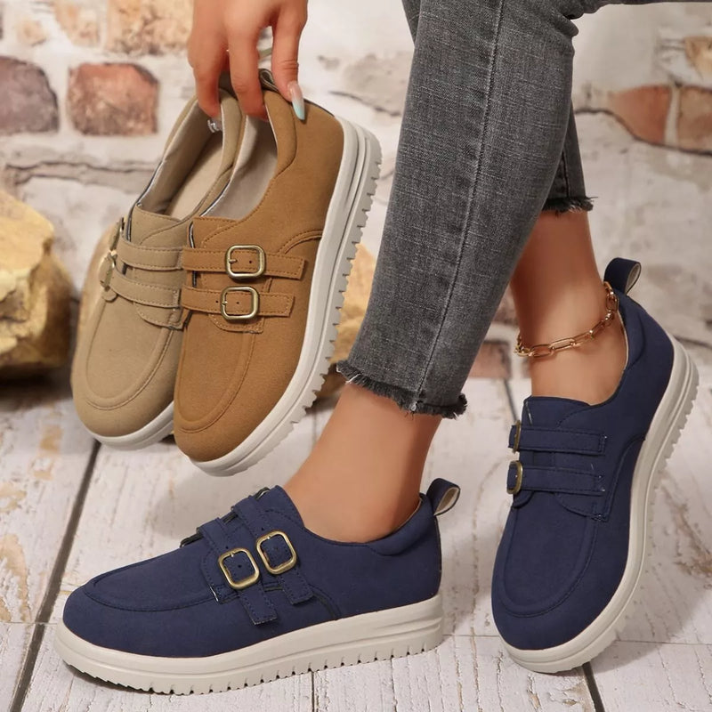 Brown and navy buckle-accent casual loafers with double buckle straps and white soles