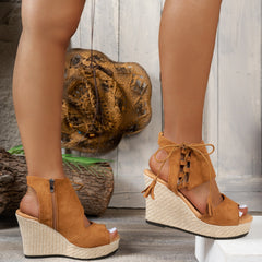 Brown open-toe wedge sandal with lace-up ankle ties and woven platform