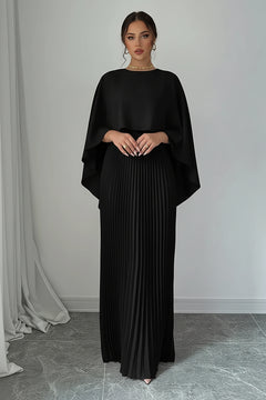 Black pleated maxi dress with flowing cape sleeves and high neckline