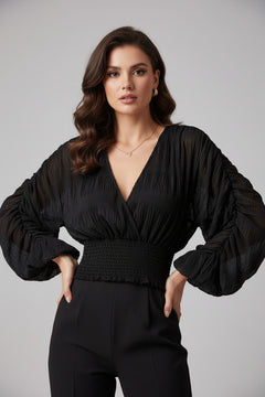 Black long-sleeve blouse with V-neck and smocked waist ruching, large gathered cuffs