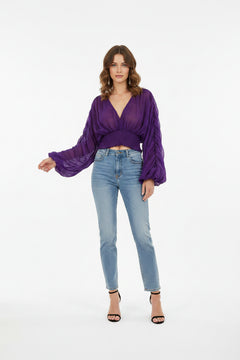 Purple long-sleeve blouse with V-neck and smocked waist, wide gathered sleeves