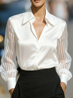 White collared button-up shirt with sheer striped sleeves and ruffled cuffs