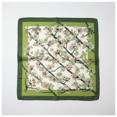 Silk scarf with butterfly and blossom branch print on light base, green border