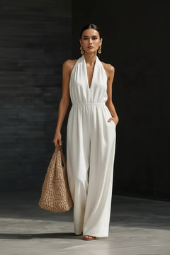 White halter-neck wide-leg jumpsuit with V-neck and sleeveless bodice