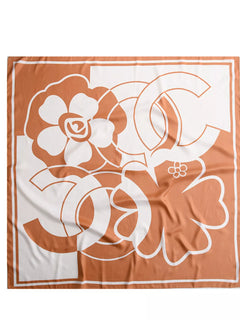 Square flower silk scarf flat lay with sherbet orange and white floral motif