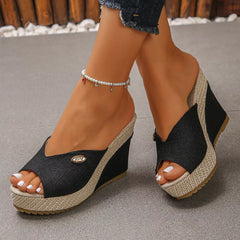 Peep-toe wedge sandals with dark fabric uppers and braided platform wedges