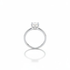 Sterling silver ring with round moissanite center in four-prong setting