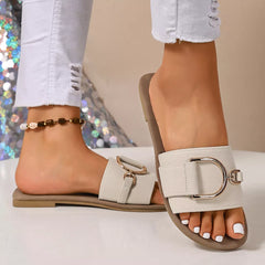 Ivory open-toe flat sandals with single wide strap and D-ring buckle