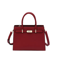 Burgundy leather handbag with front clasp and detachable shoulder straps