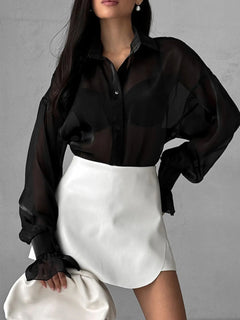 Black sheer button-up flounce sleeve shirt with puff sleeves and ruffled cuffs