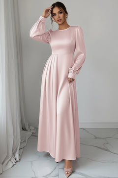 Blush pink satin maxi dress with long puff sleeves and pleated waist skirt detail
