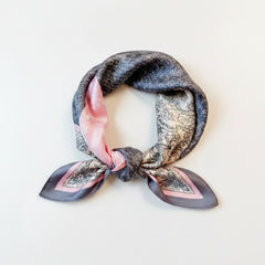 Printed silk square scarf with paisley print in blush pink, gray, and dark navy