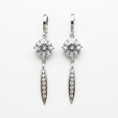 Silver moissanite drop earrings with round stones and elongated oval pavé dangles