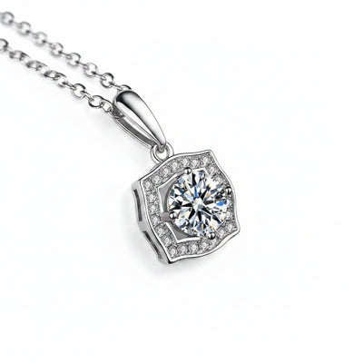 Silver necklace with square-shaped halo moissanite pendant, side view on link chain