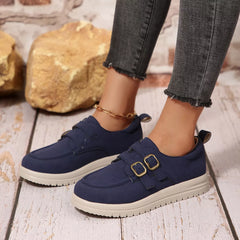 Navy buckle-accent casual loafers with double buckle straps and white sole