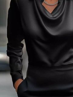 Black satin cowl neck long-sleeve blouse with draped neckline and smooth finish