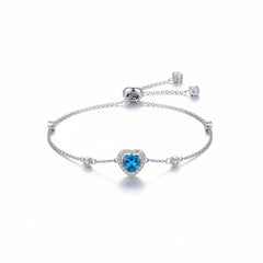 925 sterling silver bracelet with blue heart gemstone center and four small round accents